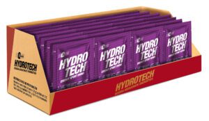 Caja abierta con sobres morados de bebida hidratante energética Hydro Tech sabor mora organizados en filas
